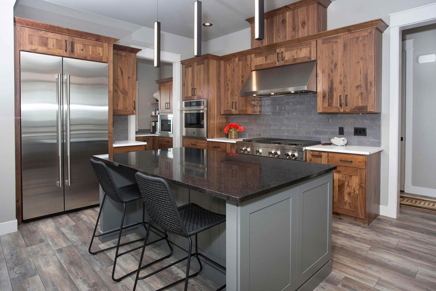 Rustic alder kitchen with gray island and granite counters
